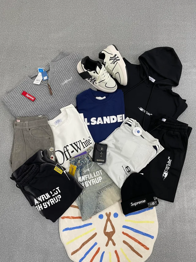 Original Reddit photo of a fall and winter clothing haul laid out on a floor