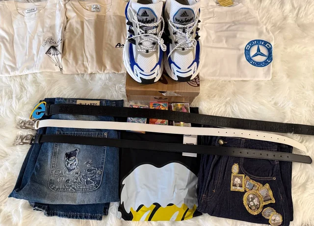 Original Reddit haul photo showing shoes, shirts, jeans and belts laid out together